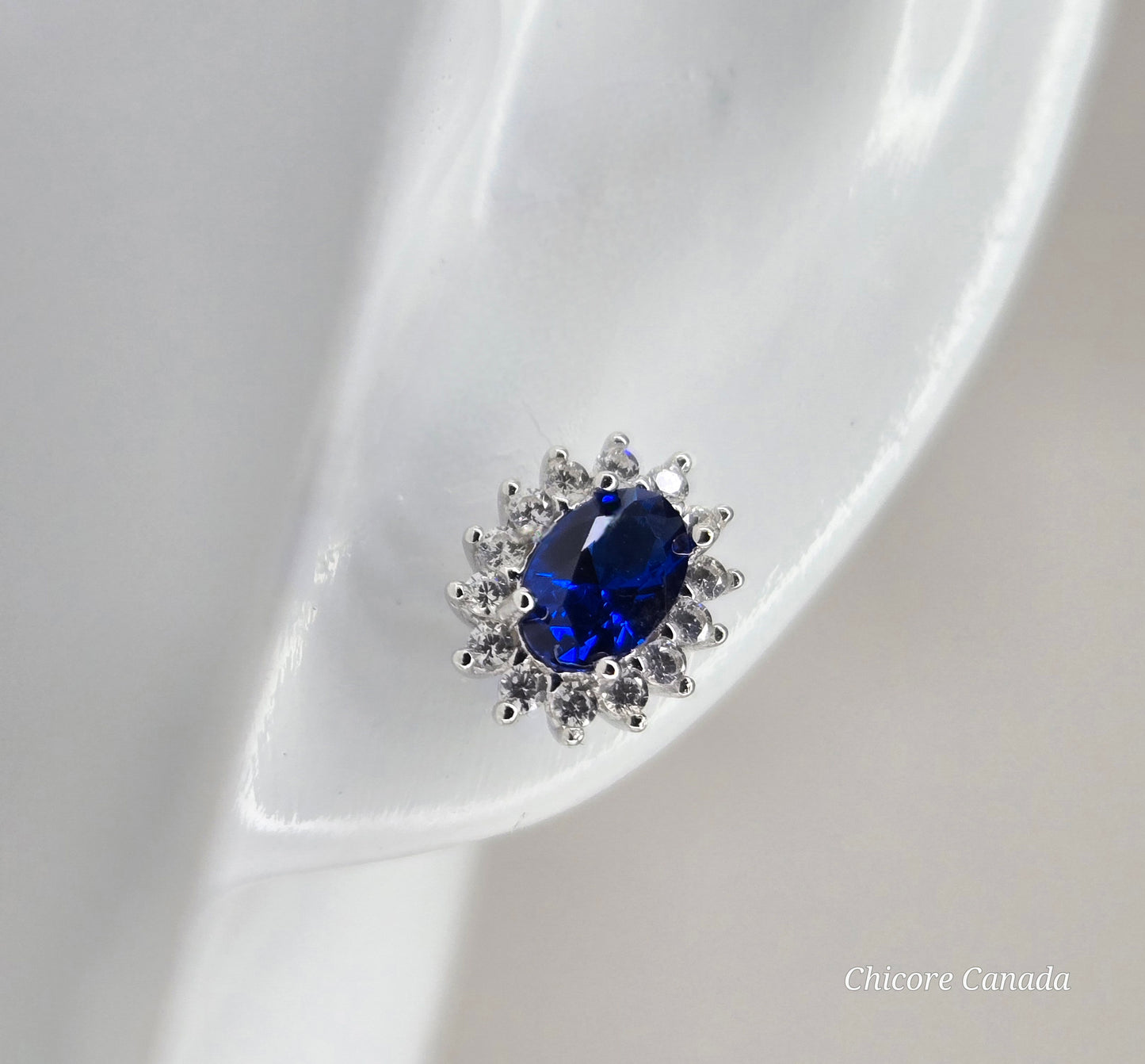 Elegant Royal Blue Sapphire Oval Stud Earrings with Halo of Sparkling Cubic Zirconia