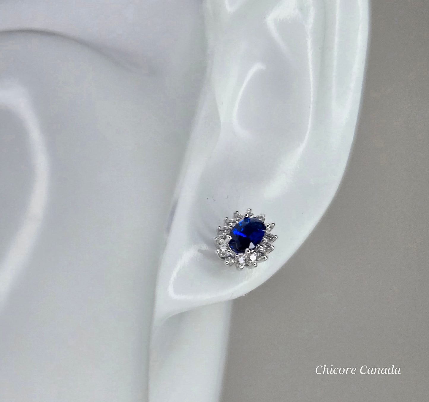Elegant Royal Blue Sapphire Oval Stud Earrings with Halo of Sparkling Cubic Zirconia