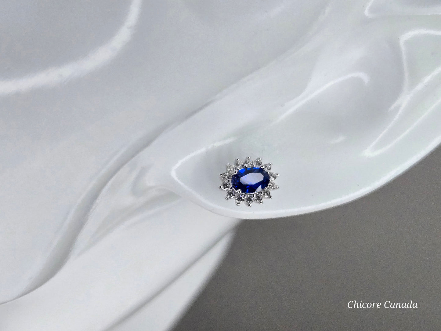 Elegant Royal Blue Sapphire Oval Stud Earrings with Halo of Sparkling Cubic Zirconia