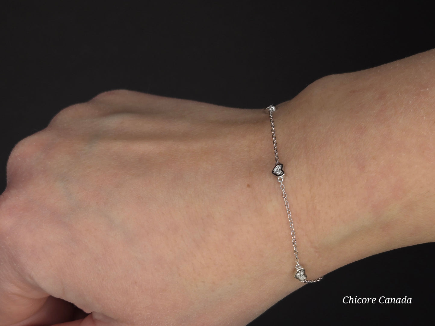 Sterling Silver Adjustable Bracelet with Three Dazzling Cubic Zirconia Heart Charms