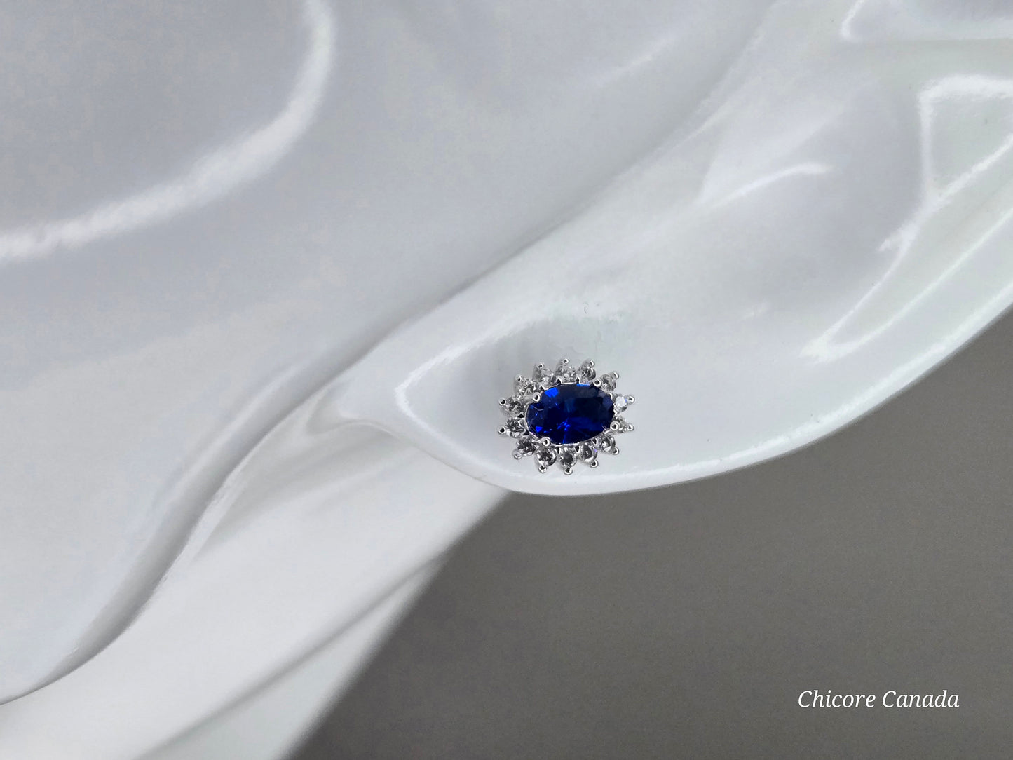 Elegant Royal Blue Sapphire Oval Stud Earrings with Halo of Sparkling Cubic Zirconia
