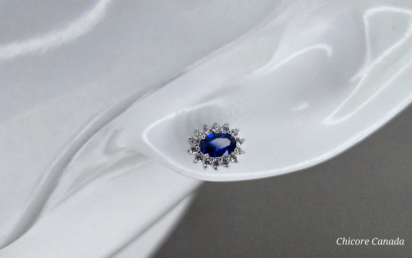Elegant Royal Blue Sapphire Oval Stud Earrings with Halo of Sparkling Cubic Zirconia