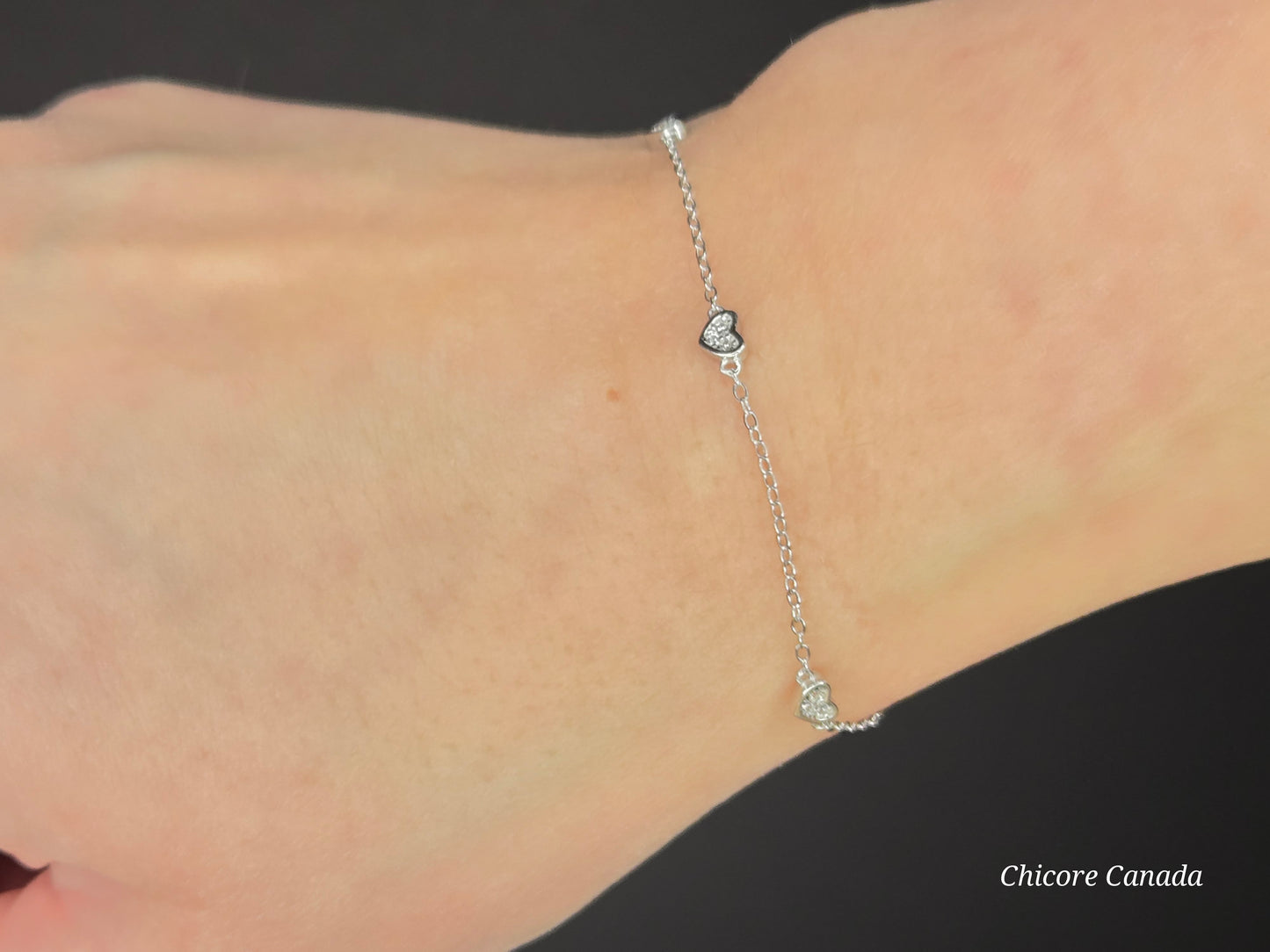 Sterling Silver Adjustable Bracelet with Three Dazzling Cubic Zirconia Heart Charms