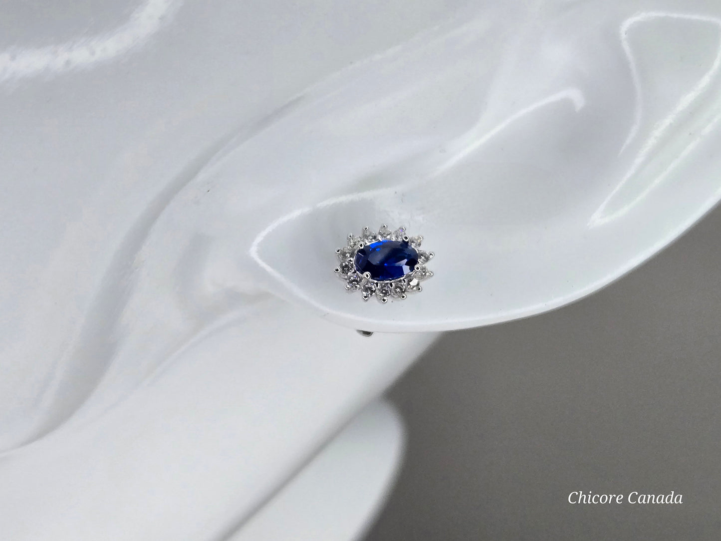 Elegant Royal Blue Sapphire Oval Stud Earrings with Halo of Sparkling Cubic Zirconia
