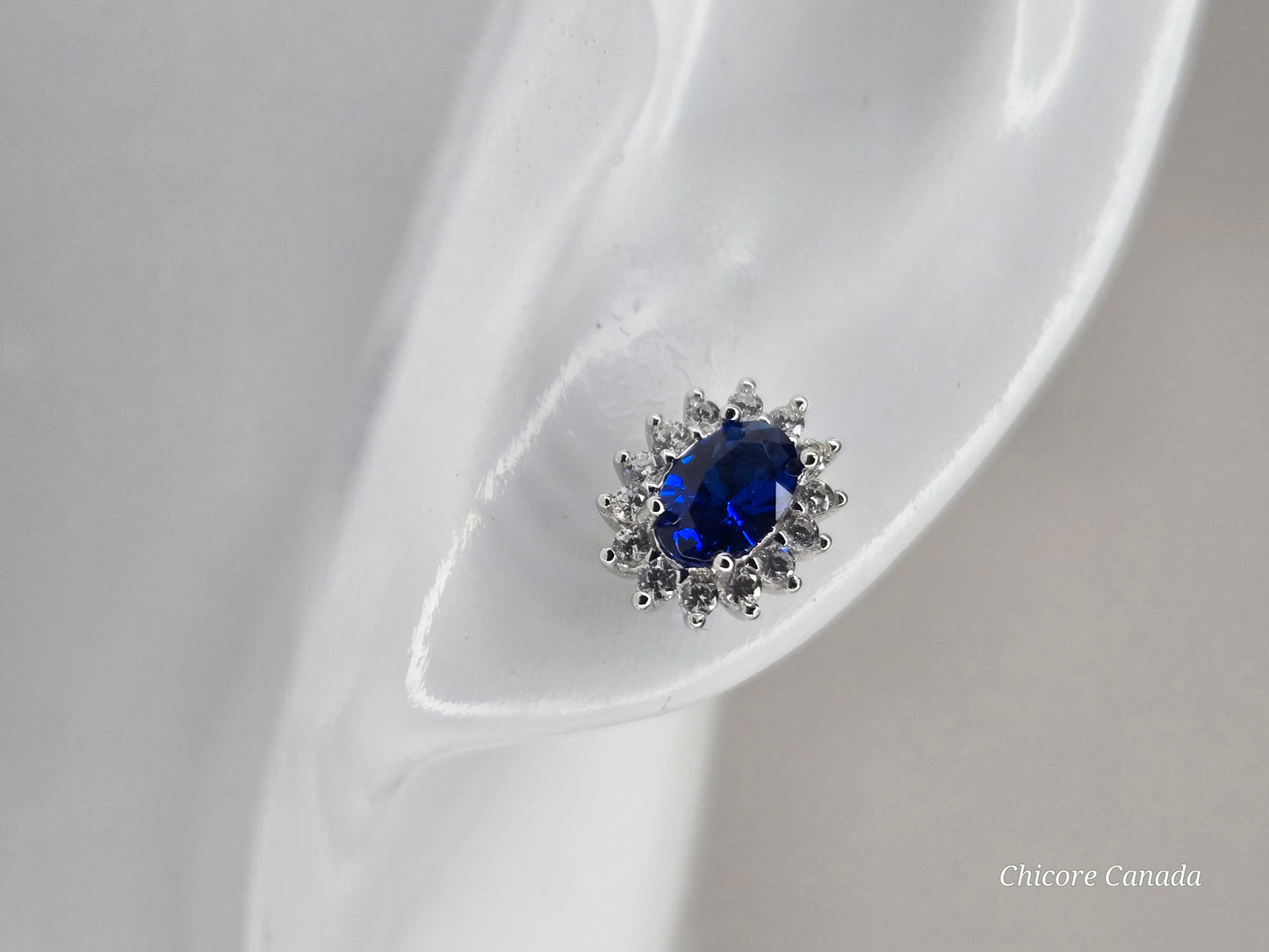 Elegant Royal Blue Sapphire Oval Stud Earrings with Halo of Sparkling Cubic Zirconia