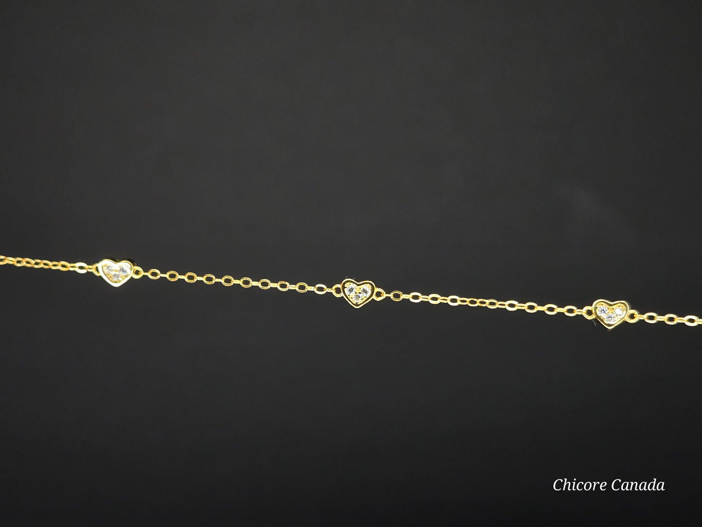 Delicate 925 Sterling Silver Adjustable Bracelet with Three Sparkling Cubic Zirconia Hearts