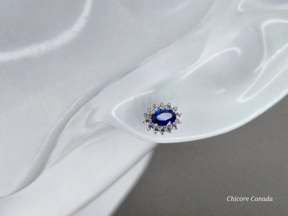 Elegant Royal Blue Sapphire Oval Stud Earrings with Halo of Sparkling Cubic Zirconia