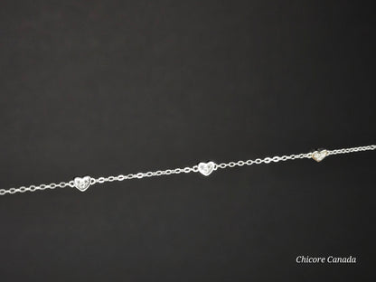 Sterling Silver Adjustable Bracelet with Three Dazzling Cubic Zirconia Heart Charms